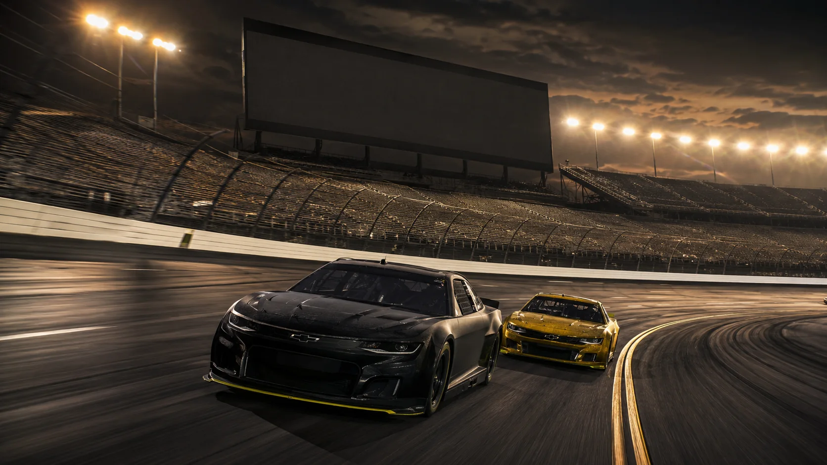 Professional stock cars racing under stadium lights